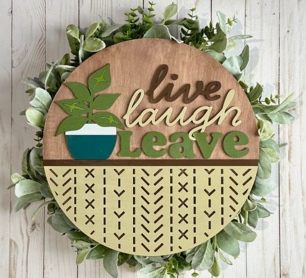 Painted version of wooden sign kit saying Live Laugh Leave.