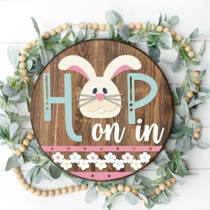 Painted version of wooden sign kit saying Hop on In.