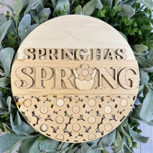 Painted version of wooden sign kit saying Spring has Sprung.